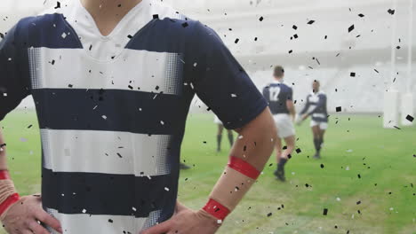Animation-of-black-confetti-falling-over-Caucasian-male-rugby-player