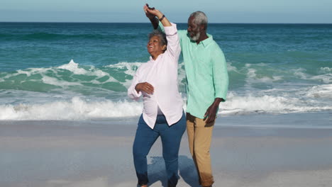Senior-couple-dancing-at-the-beach