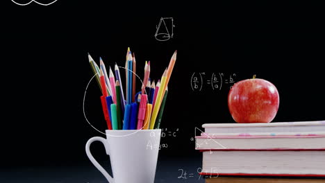 Mathematical-equations-floating-against-apple-on-stack-of-books-and-pencil-stand