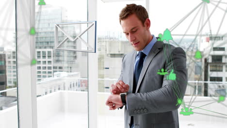 Envelope-icon-and-globe-of-digital-icons-against-businessman-using-smartwatch-in-office