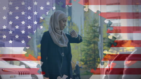 Animation-of-American-flag-waving-with-jigsaw-puzzles-revealing-mixed-race-woman-in-hijab