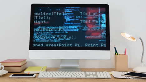 Digital-composition-of-data-processing-on-computer-screen-on-wooden-table-against-white-background