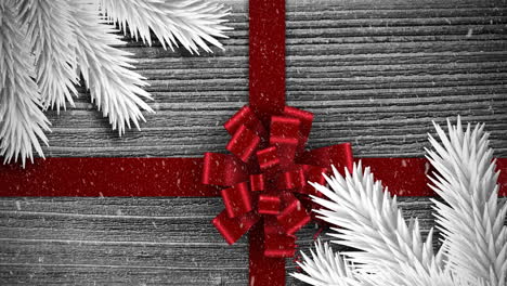 Animation-Eines-Weihnachtlichen-Roten-Geschenkbandes-Mit-Schnee,-Der-Auf-Grau-Fällt