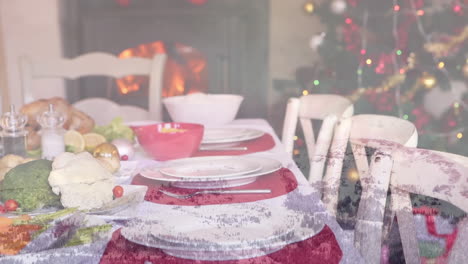 Animation-of-table-set-for-christmas-meal-over-winter-scenery