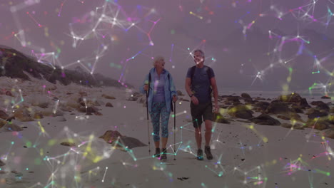 Caucasian-senior-couple-hiking-in-countryside,-over-colourful-moving-network-of-connections