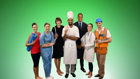 Animation-of-group-of-professionals-smiling-over-green-background