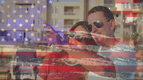American-flag-grunge-design-effect-against-caucasian-couple-pointing-towards-a-direction