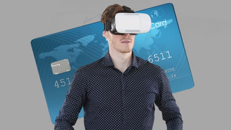 Caucasian-man-wearing-vr-headset-over-bank-card