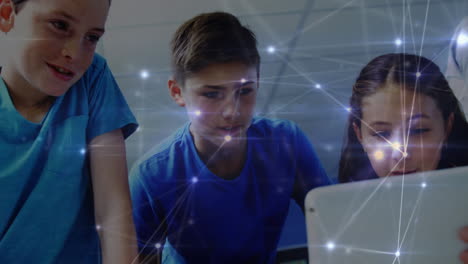 Glowing-network-of-connections-against-group-of-students-using-digital-tablet-at-elementary-school