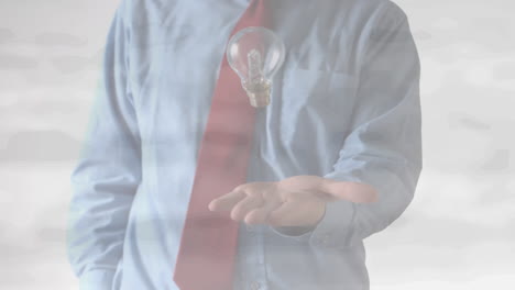 Animation-of-midsection-of-businessman-throwing-and-catching-lightbulb