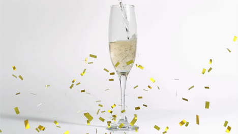 Animation-of-gold-confetti-falling-over-glass-of-champagne-on-white-background