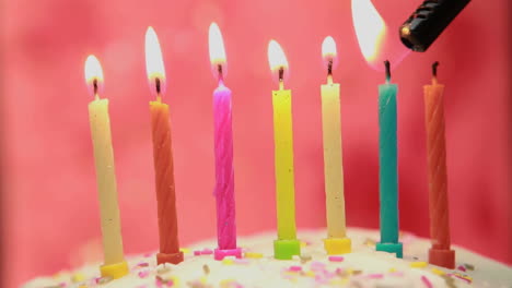 Animation-of-burning-layer-over-lit-candles-on-birthday-cake