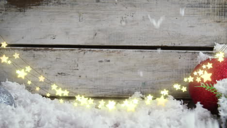 Animation-of-star-string-lights,-snow-and-christmas-bauble