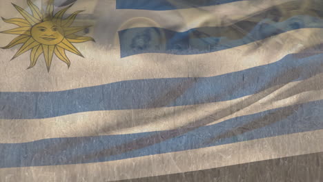 Animation-of-flag-of-uruguay-waving-over-agricultural-field