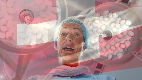 Animation-Der-Flagge-Der-Schweiz,-Die-über-Einer-Chirurgin-Im-Operationssaal-Weht