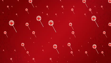 Animation-of-lollipops-falling-on-red-background