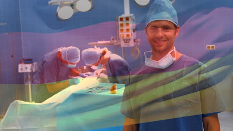 Animation-of-flag-of-germany-waving-over-surgeons-in-operating-theatre