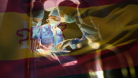 Animation-of-flag-of-spain-waving-over-surgeons-in-operating-theatre