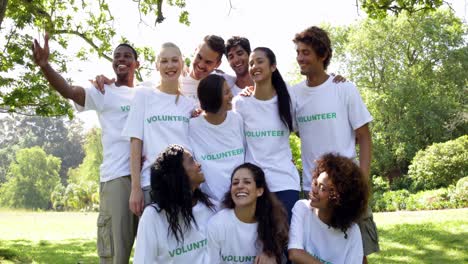 Group-of-volunteers-smiling-at-the-camera
