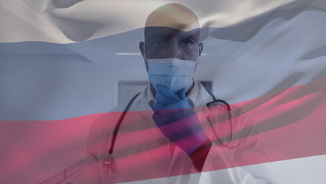 Animation-of-flag-of-russia-waving-over-doctor-wearing-face-mask