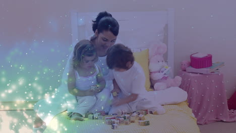 Animation-of-glowing-spots-over-happy-biracial-mother-with-son-and-daughter-playing-together