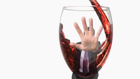 Animation-of-glass-of-wine-over-caucasian-businessman-on-white-background