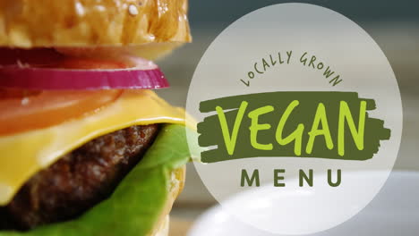 Animation-of-vegan-locally-grown-text-over-close-up-of-burger