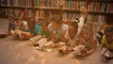 Animation-of-letters-spinning-over-teacher-and-happy-school-children-lying-on-floor-with-books