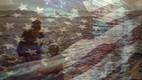 Animation-of-flag-of-america-over-caucasian-mother-with-child-playing-at-beach
