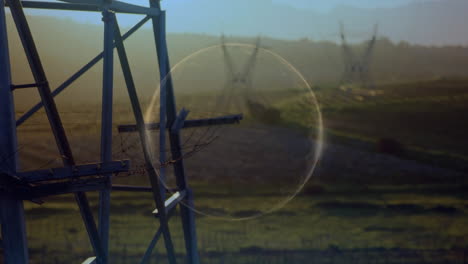 Animation-of-circle-over-landscape-with-electricity-pylons