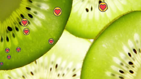 Animation-of-heart-icons-over-kiwi-fruit
