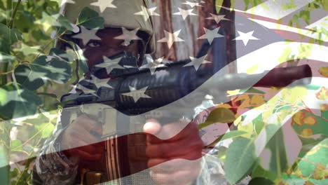 Animación-De-La-Bandera-De-Estados-Unidos-Sobre-Un-Soldado-Afroamericano-Con-Ametralladora.