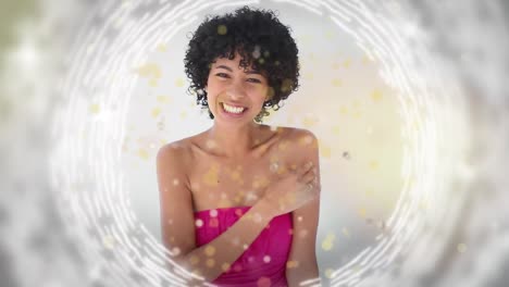 Animation-of-gold-dots-over-happy-biracial-woman-sending-kisses
