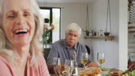 Portrait-of-happy-senior-diverse-people-having-dinner-at-retirement-home
