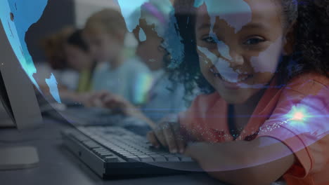 Animation-of-globe-over-diverse-schoolchildren-using-computers-in-classroom