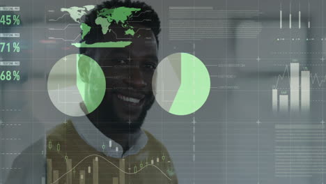 Statistical-data-processing-over-portrait-of-african-american-man-smiling-at-office