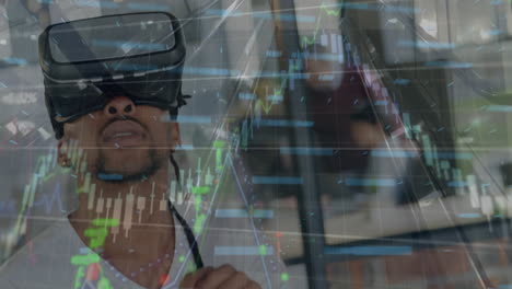 Animation-of-financial-data-processing-over-biracial-man-wearing-vr-headset