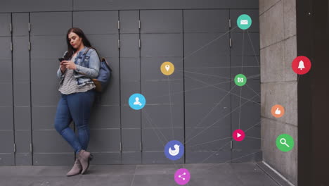 Animation-of-network-of-connections-with-icons-over-caucasian-woman-using-smartphone