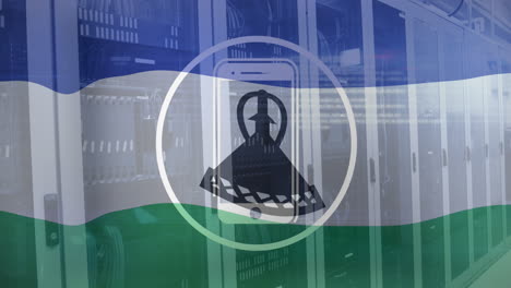 Animation-of-cellphone-in-circle-flag-of-lesotho-over-computer-language-on-data-server-racks
