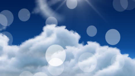 Animation-of-light-spots-falling-over-clouds-on-blue-sky