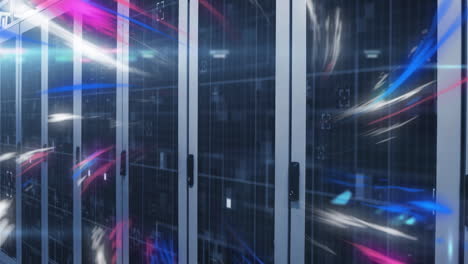 Animation-of-multicolored-waves-over-data-server-racks-in-server-room
