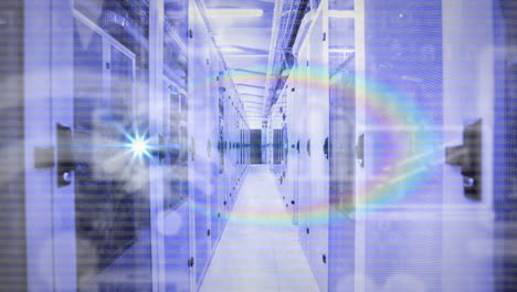 Animation-of-rainbow-lens-flare-and-digital-icons-over-empty-computer-server-room