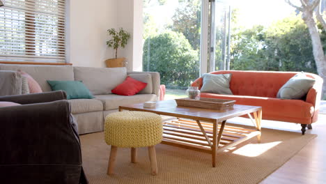 Bright-living-room-with-sunny-garden,-slow-motion