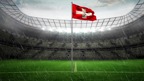 Animation-Von-Regen-Und-Stadion-über-Der-Flagge-Der-Schweiz