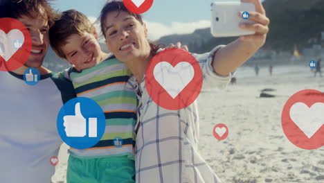 Animation-of-hearts-over-happy-caucasian-family-taking-photo-on-beach