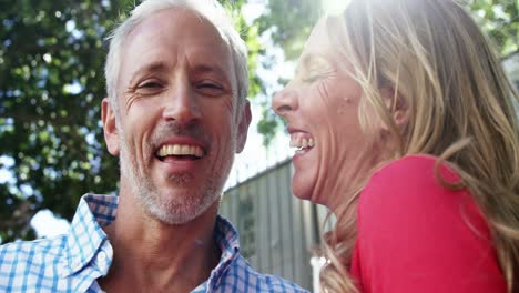 Mature-couple-is-embracing-and-laughing-in-the-street-