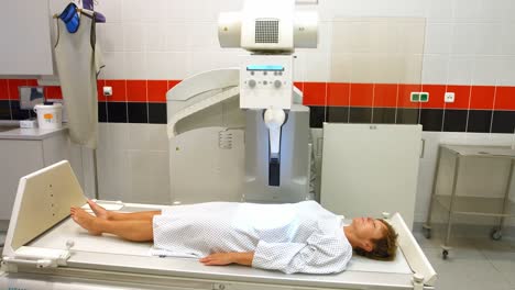 A-female-patient-lying-in-x-ray-room