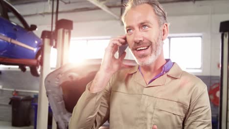 Mechanic-talking-on-a-mobile-phone