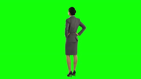 Business-woman-standing-and-looking-around
