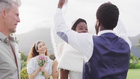 Happy-african-american-married-couple-with-diverse-friends